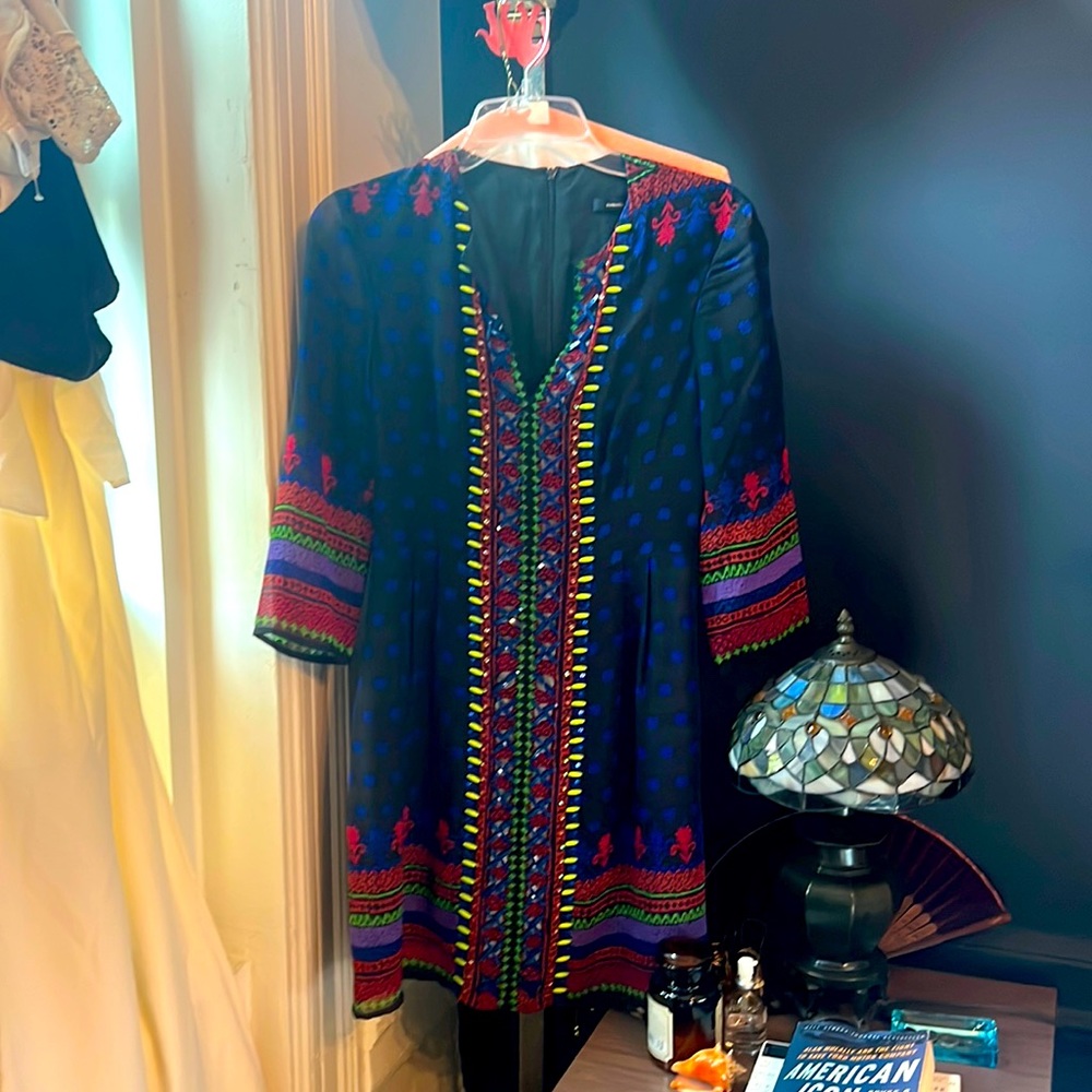 Incredible dress. Unique. Sheer in the arms and beaded. Light and easy to wear.